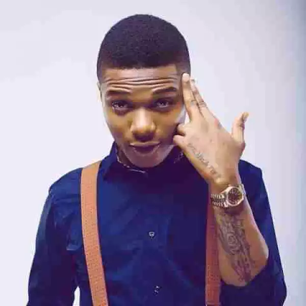 Crazy Fan Tattooed Her Back With Wizkid Face (See Photos)